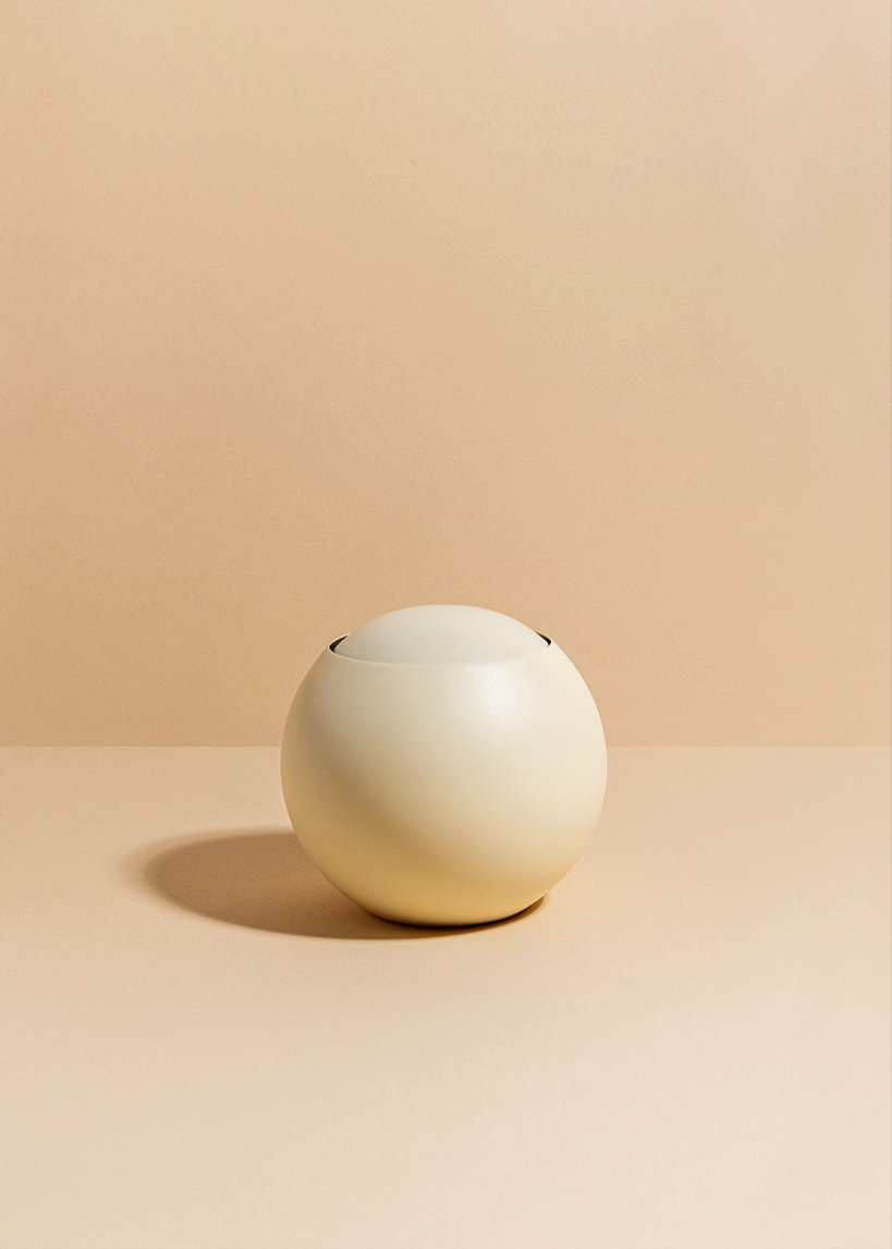 A cream-colored netilat yadaim vessel | כלי לנטילת ידיים שמנת